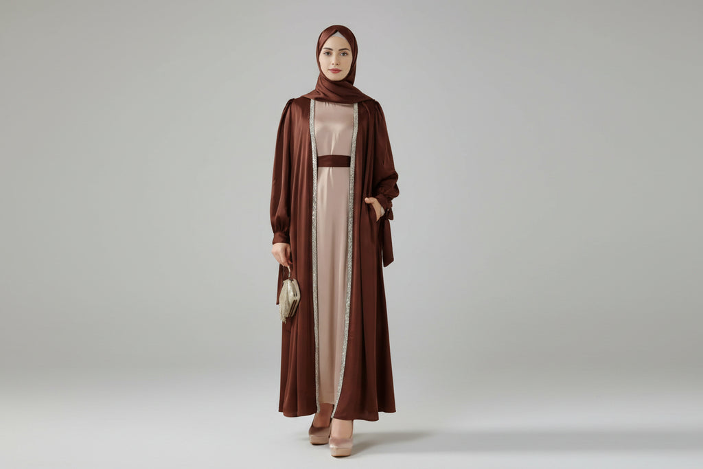 Woman wearing a brown abaya and hijab on a beige background
