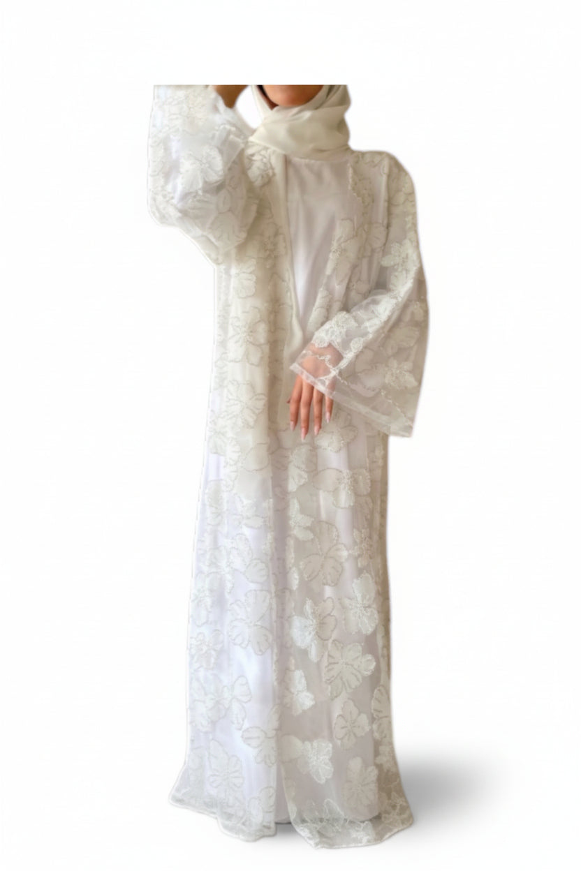 White lace dress with long sleeves on a white background